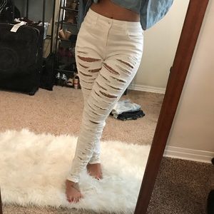 High waisted destroyed white jeans